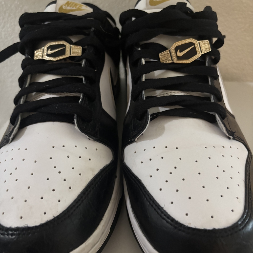 Nike Black and White Sneakers with Gold Accents